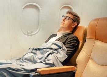 How does cabin pressure impact sleep quality during long-haul flights?